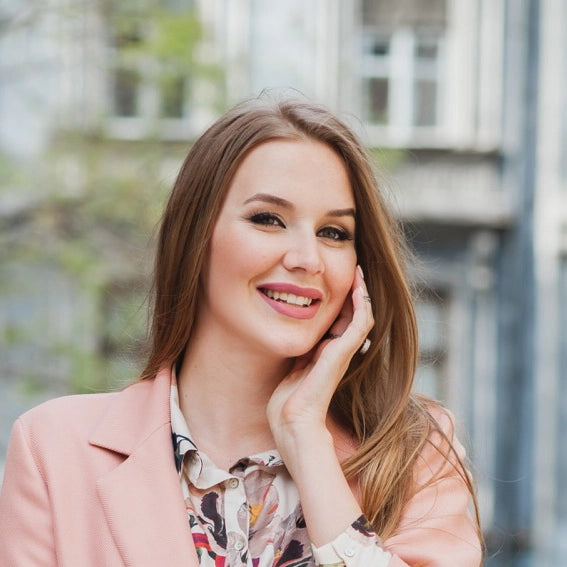 files/portrait-attractive-stylish-smiling-woman-walking-city-street-pink-coat-floral-dress_-_Grande_994e346e-2074-436f-b87b-3d715a019354.webp